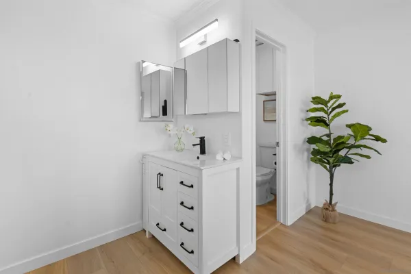 a view of kitchen with cabinets and wooden floor