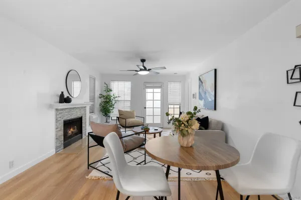 a view of a dining room with furniture window and wooden floor