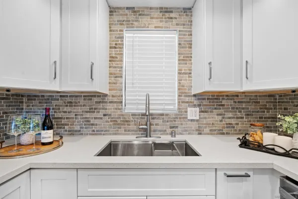 a kitchen with a sink and cabinets