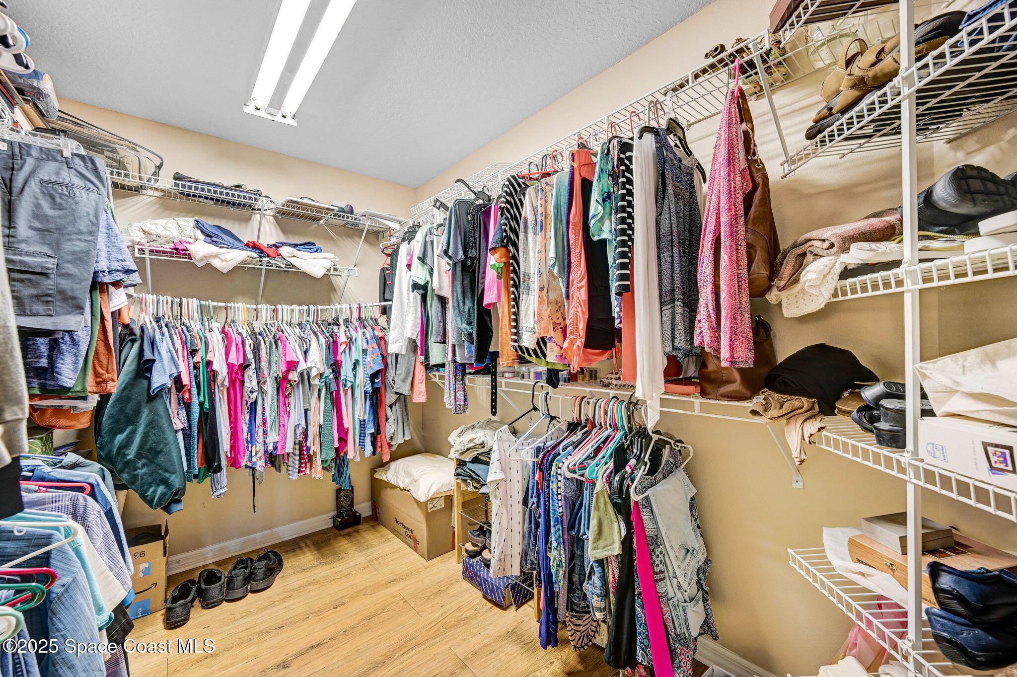 1507 Meadowbrook Road Northeast Palm Bay, FL 32905 - Photo 15 of 50 a view of walk in closet with clothes