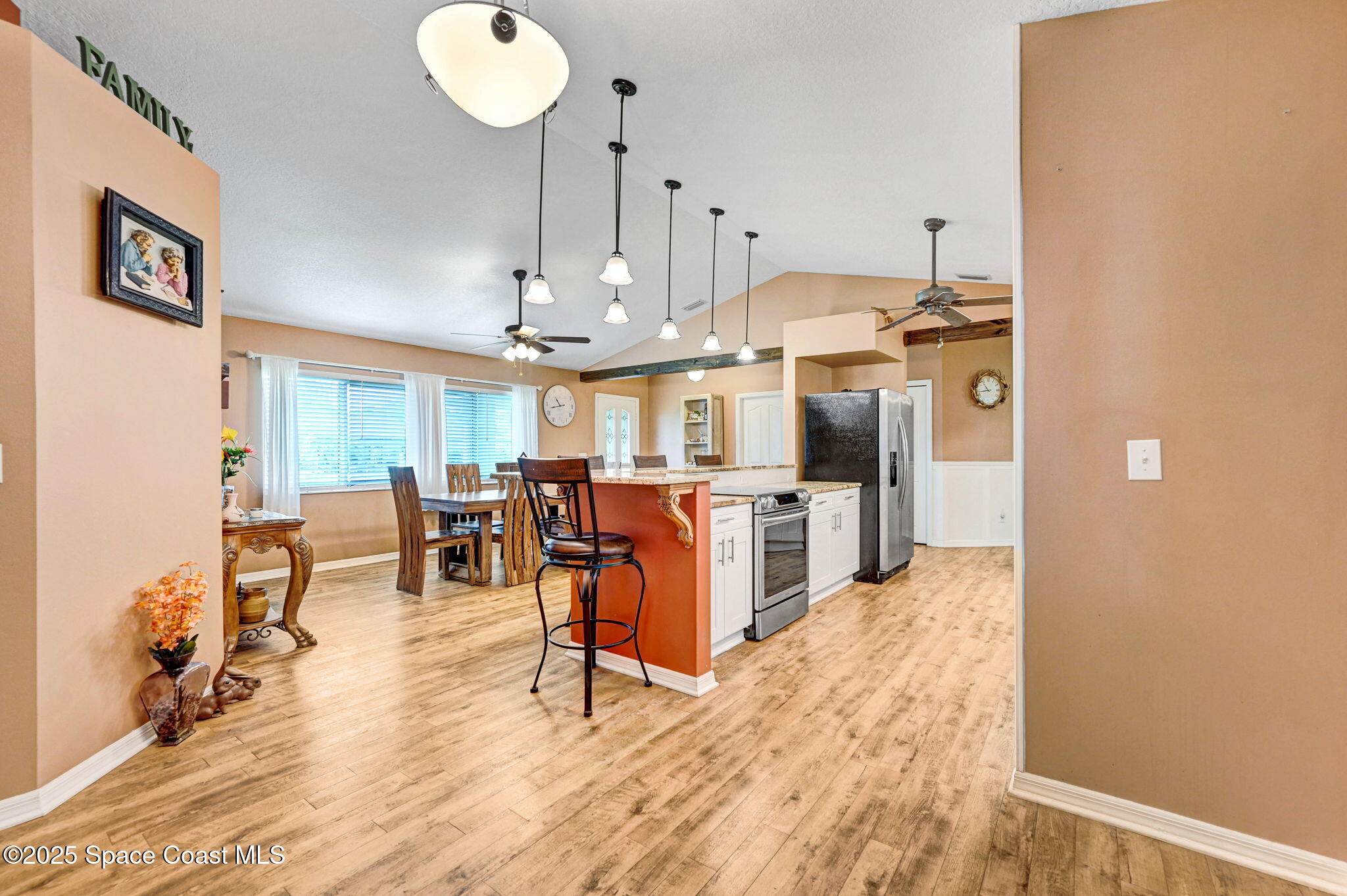 1507 Meadowbrook Road Northeast Palm Bay, FL 32905 - Photo 17 of 50 a view of a kitchen with dining area a sink and dishwasher