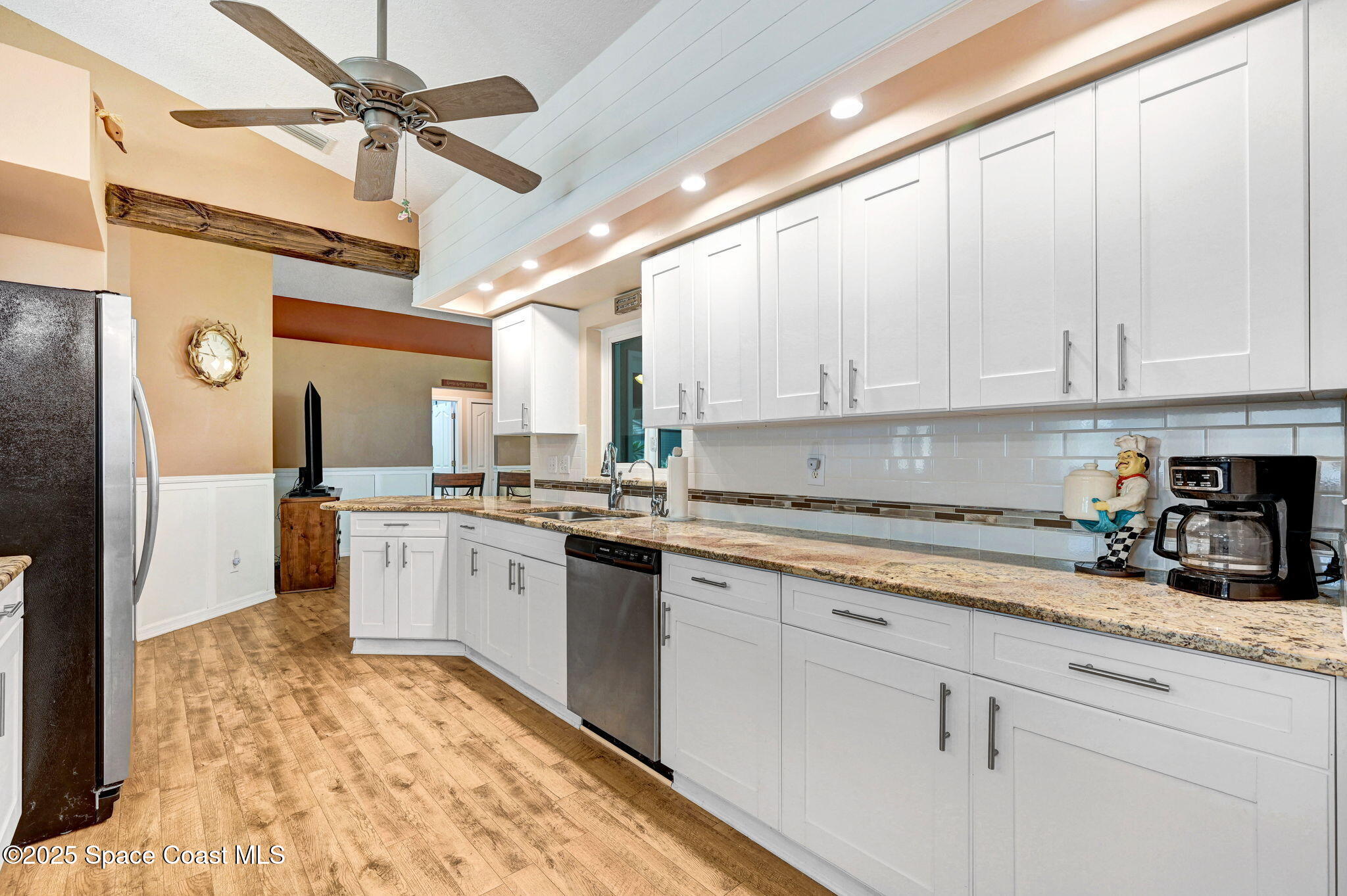 1507 Meadowbrook Road Northeast Palm Bay, FL 32905 - Photo 19 of 50 a kitchen with cabinets appliances and a counter space