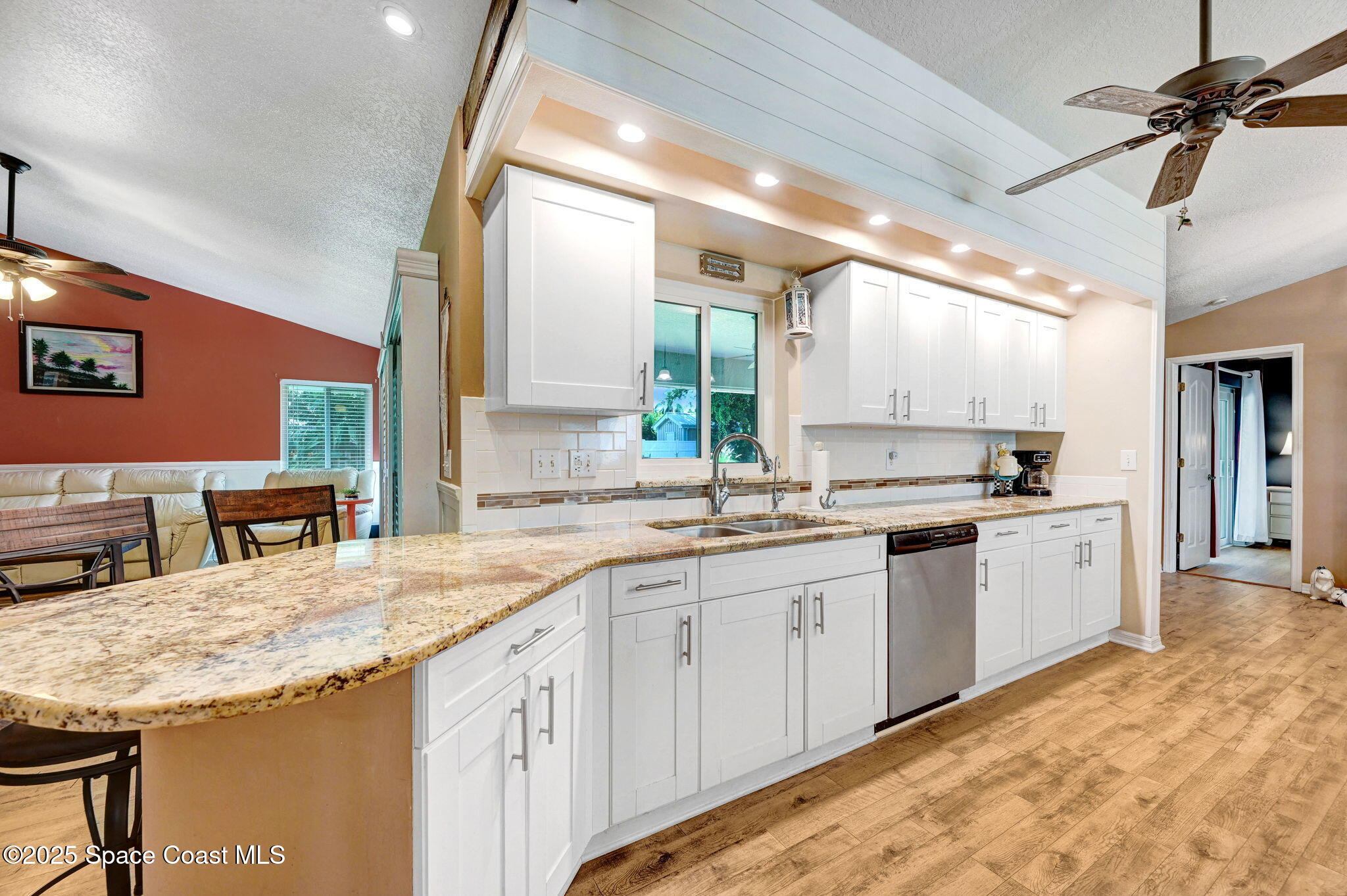 1507 Meadowbrook Road Northeast Palm Bay, FL 32905 - Photo 20 of 50 a kitchen with lots of counter space sink and appliances