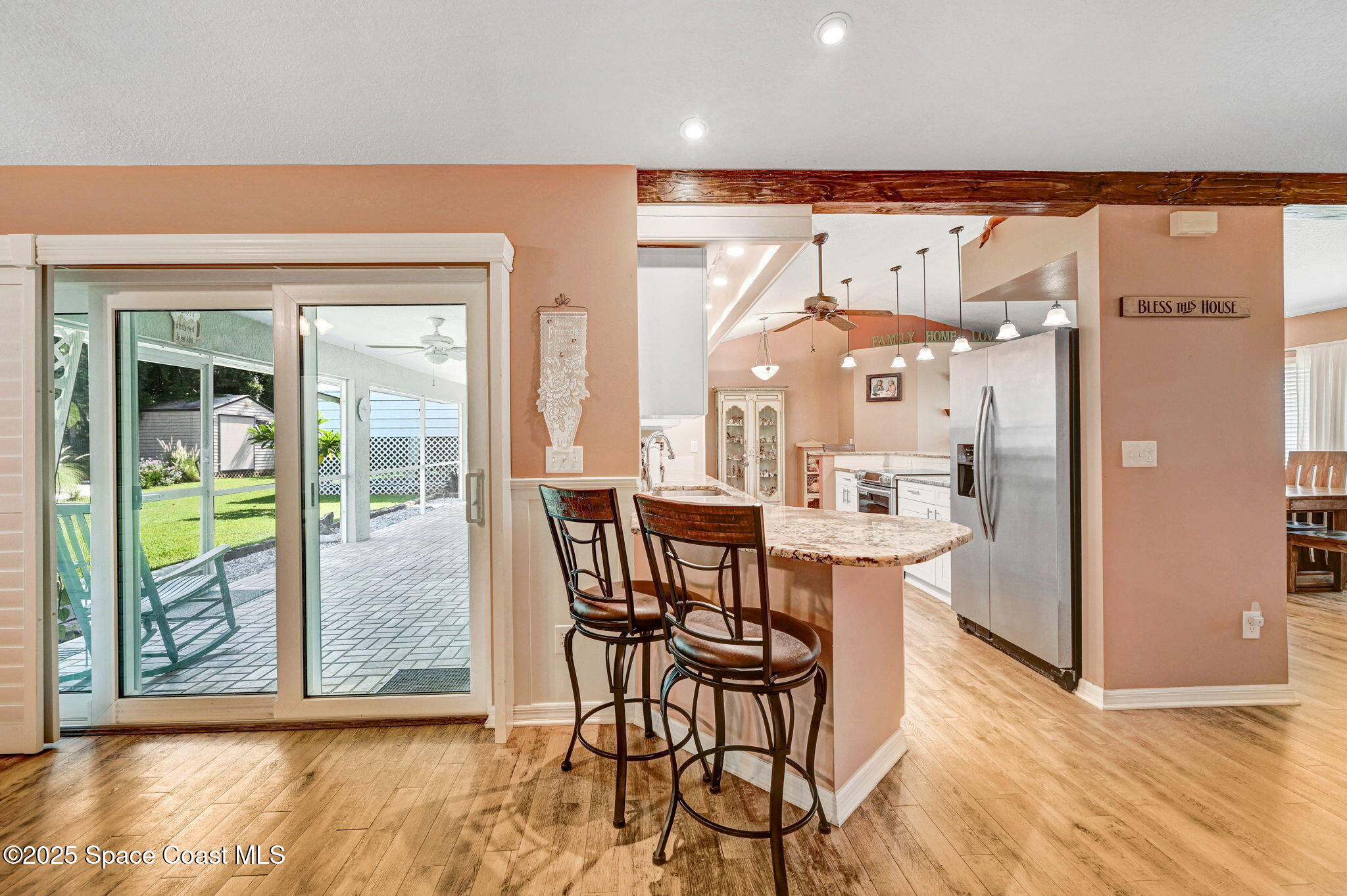 1507 Meadowbrook Road Northeast Palm Bay, FL 32905 - Photo 49 of 50 a view of a kitchen with furniture and a window