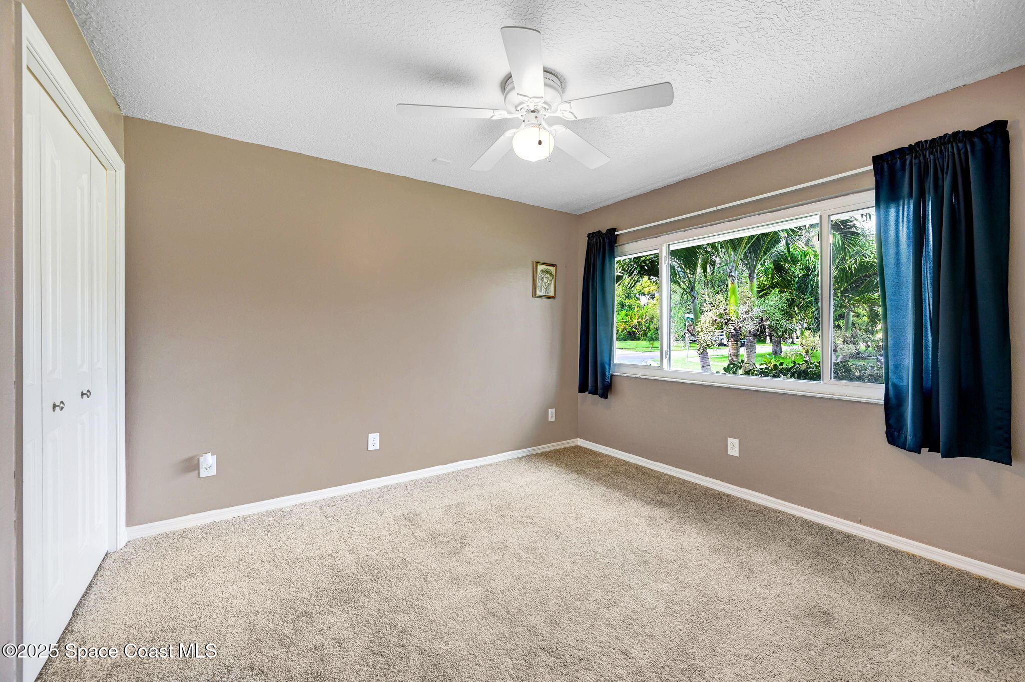 1507 Meadowbrook Road Northeast Palm Bay, FL 32905 - Photo 23 of 50 a view of a room with a large window