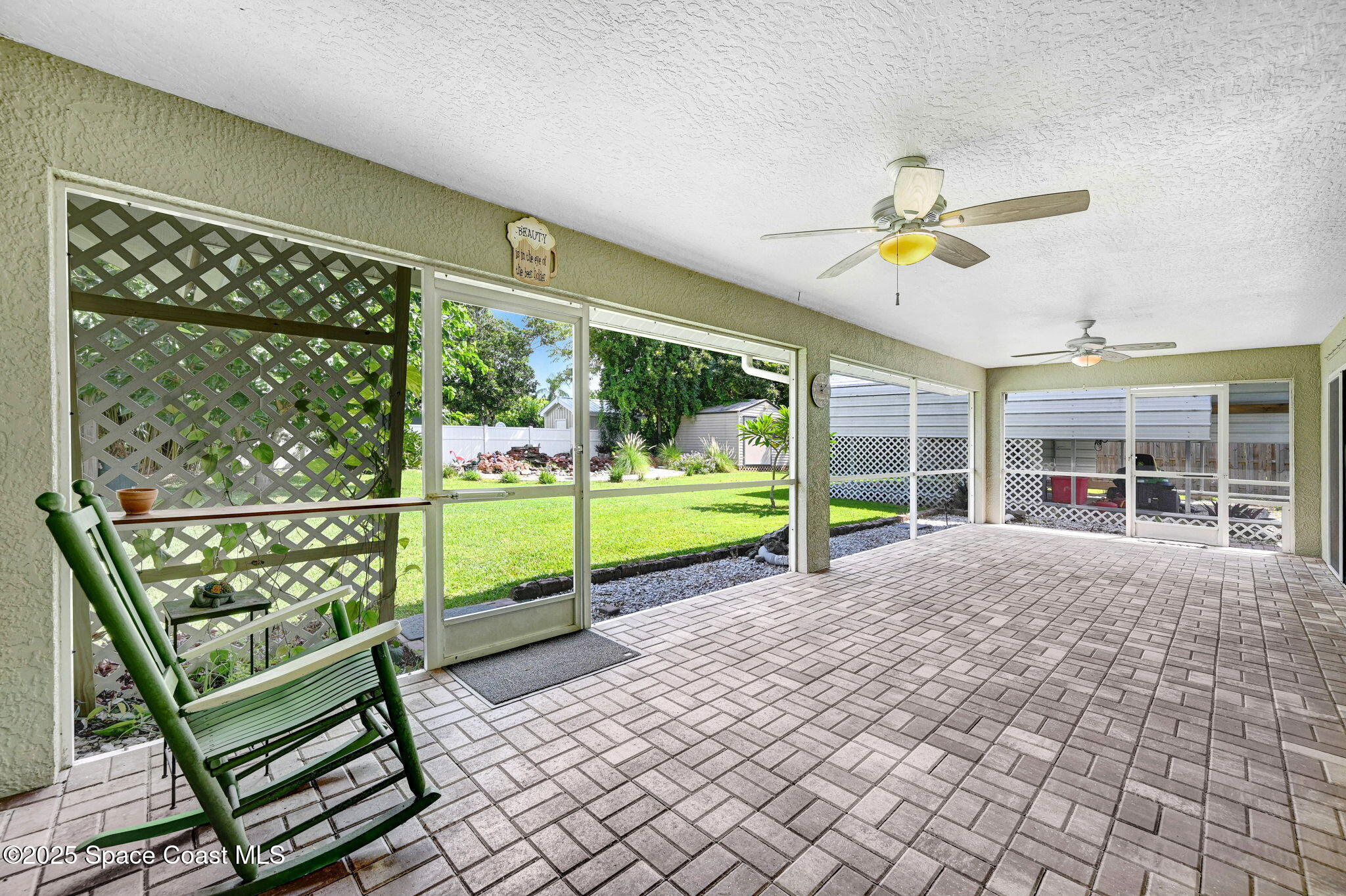 1507 Meadowbrook Road Northeast Palm Bay, FL 32905 - Photo 29 of 50 a view of a porch with furniture and garden