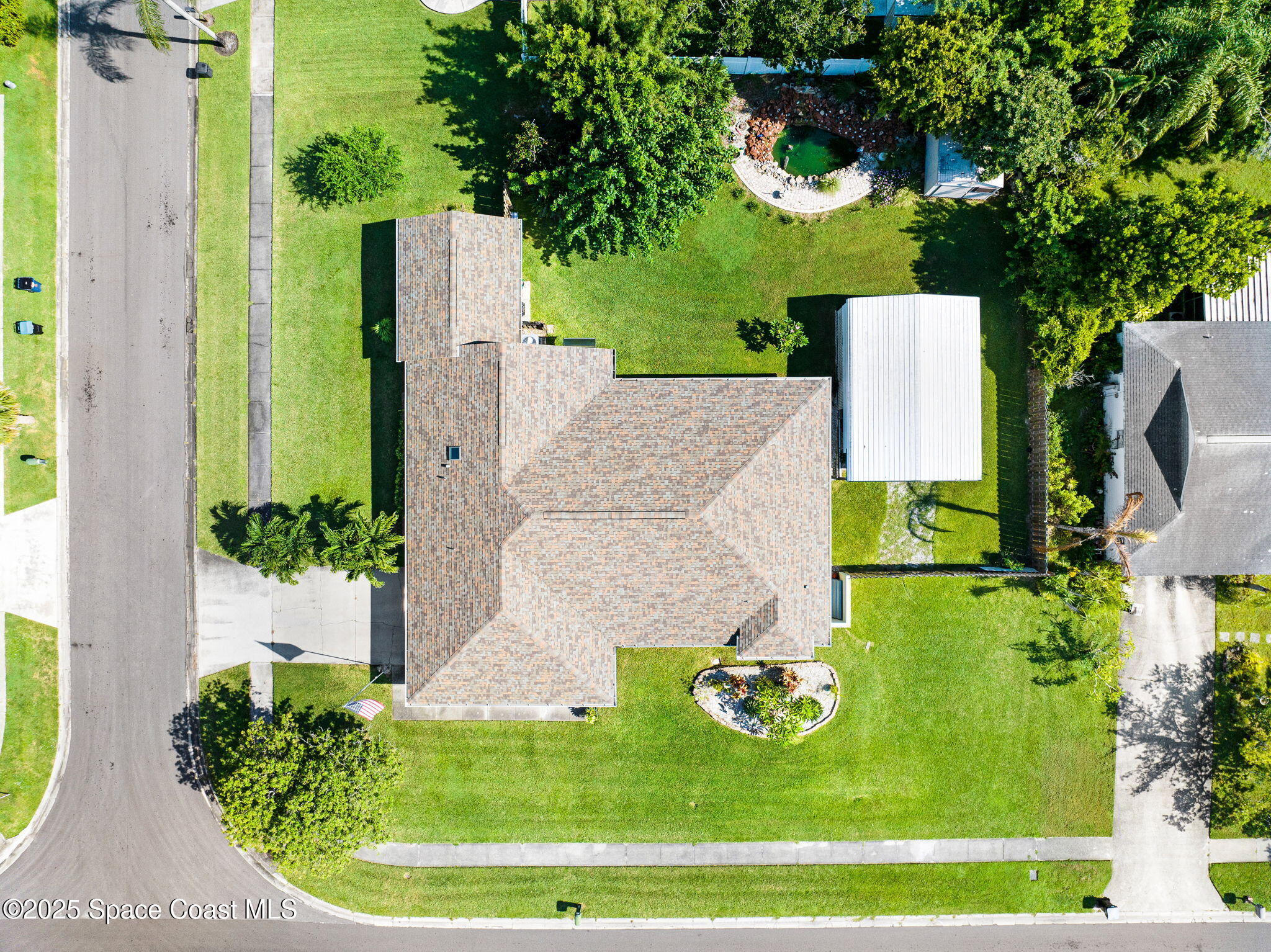 1507 Meadowbrook Road Northeast Palm Bay, FL 32905 - Photo 38 of 50 an aerial view of a house with outdoor space