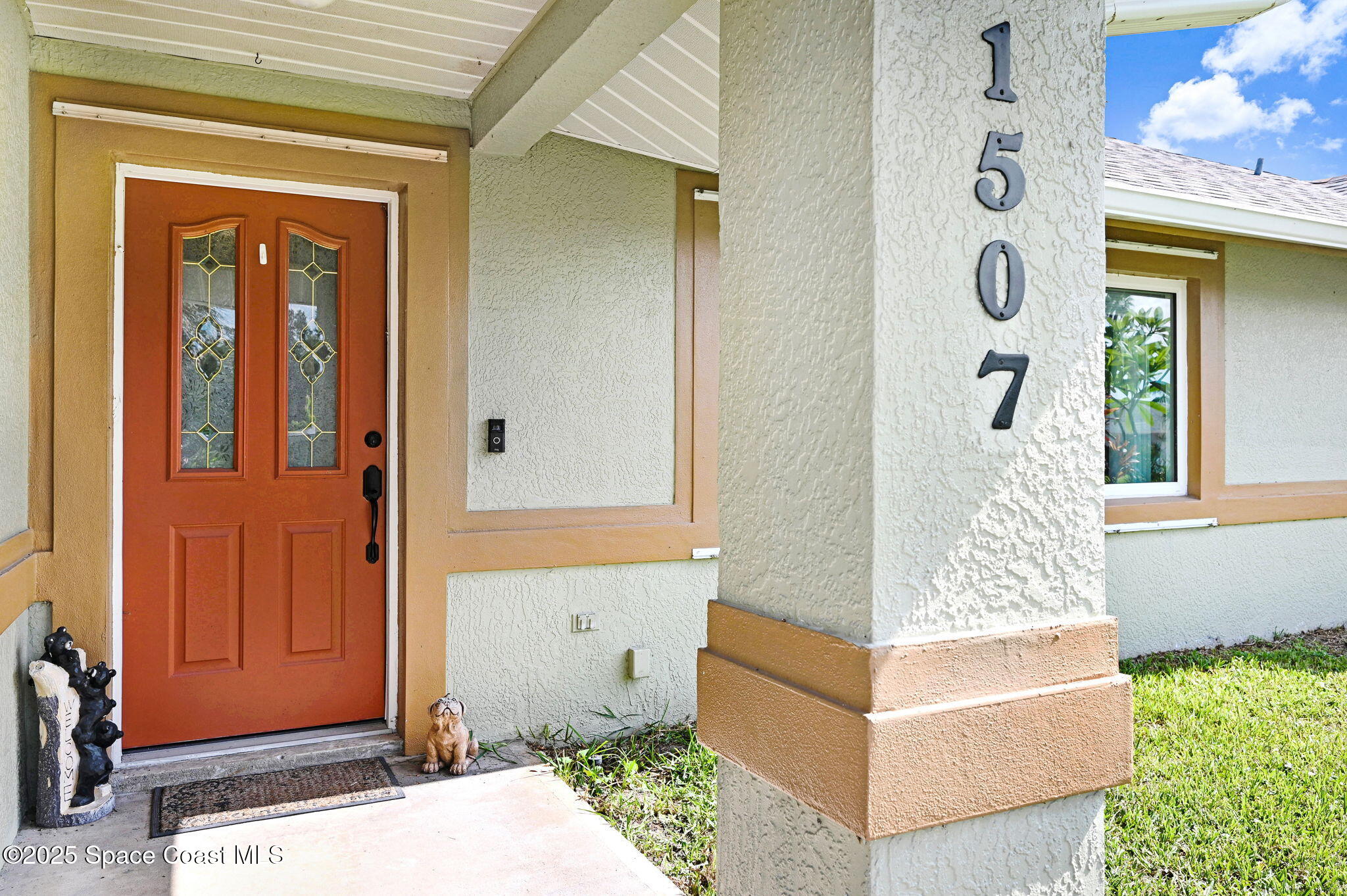 1507 Meadowbrook Road Northeast Palm Bay, FL 32905 - Photo 4 of 50 an entryway with wooden floor