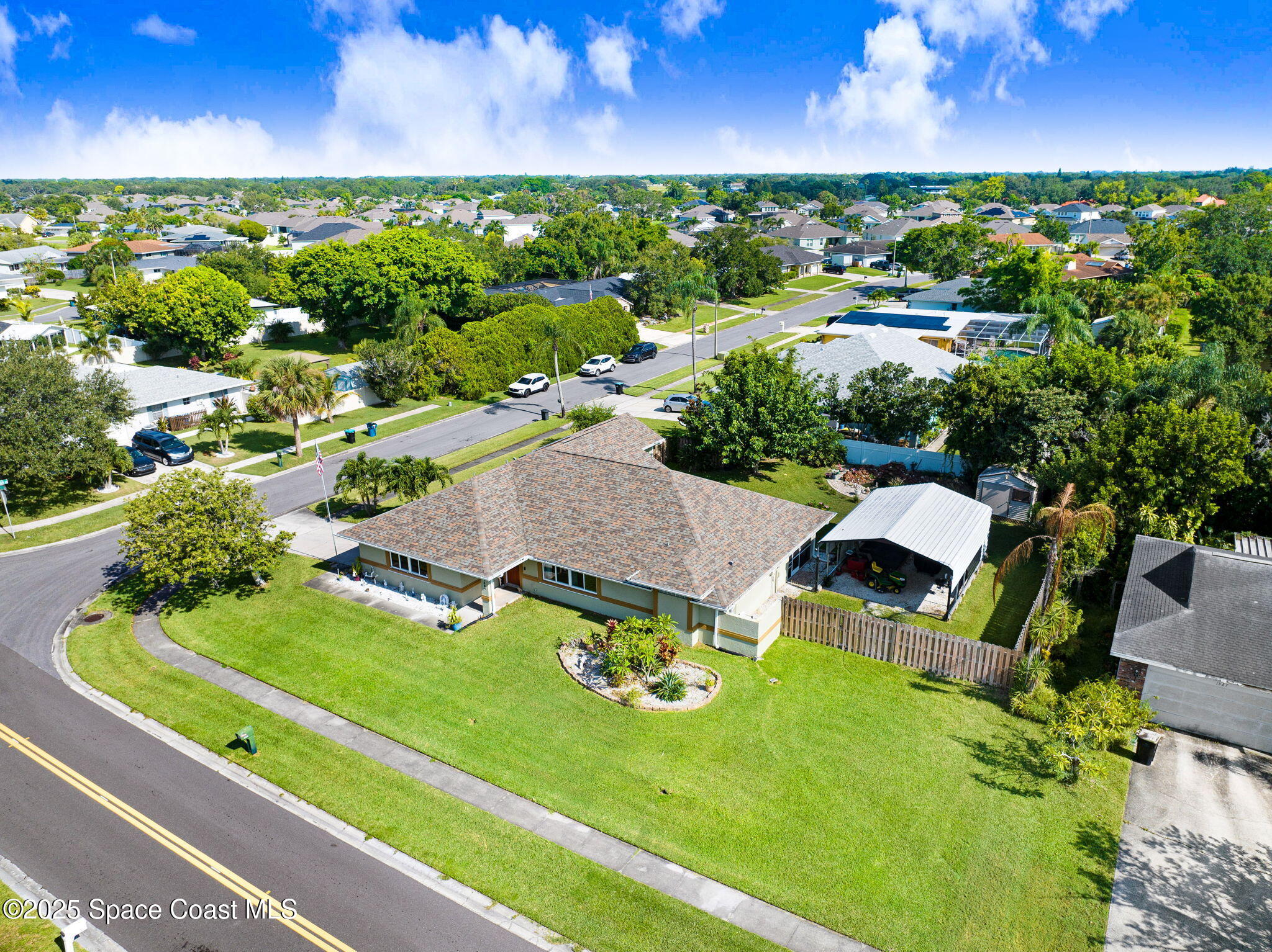 1507 Meadowbrook Road Northeast Palm Bay, FL 32905 - Photo 41 of 50 an aerial view of a house with garden space and street view