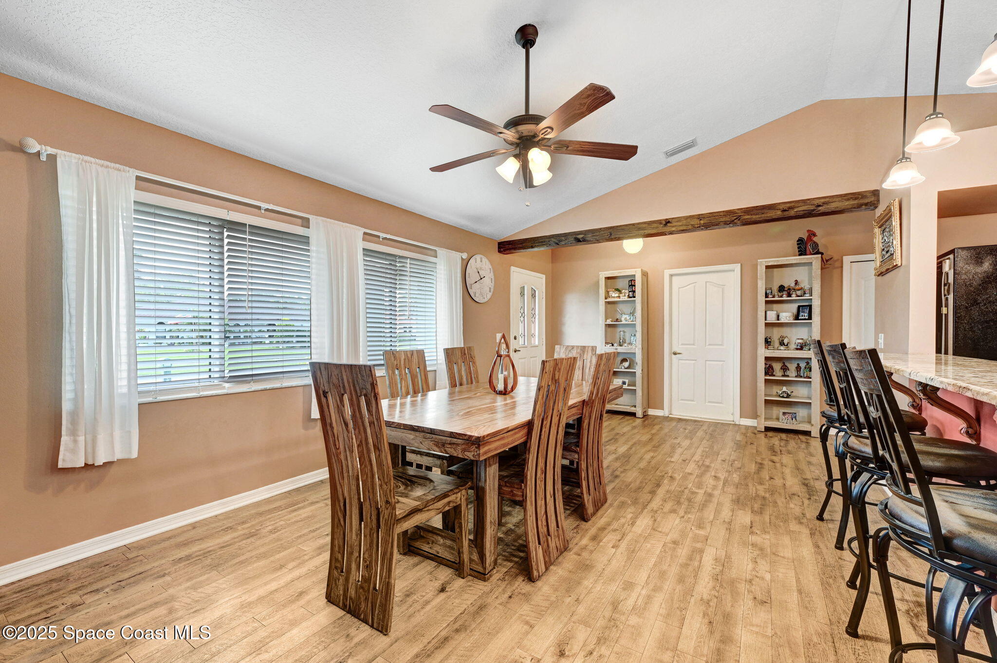 1507 Meadowbrook Road Northeast Palm Bay, FL 32905 - Photo 6 of 50 a view of a dining room with furniture and window