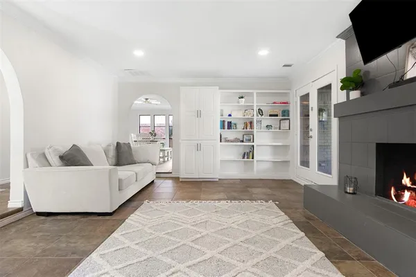 a living room with furniture and a fireplace