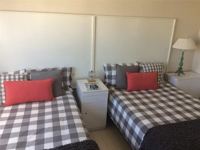 a workspace with wooden floor and windows