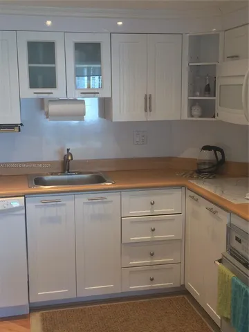 a view of a dining room with furniture and a large window