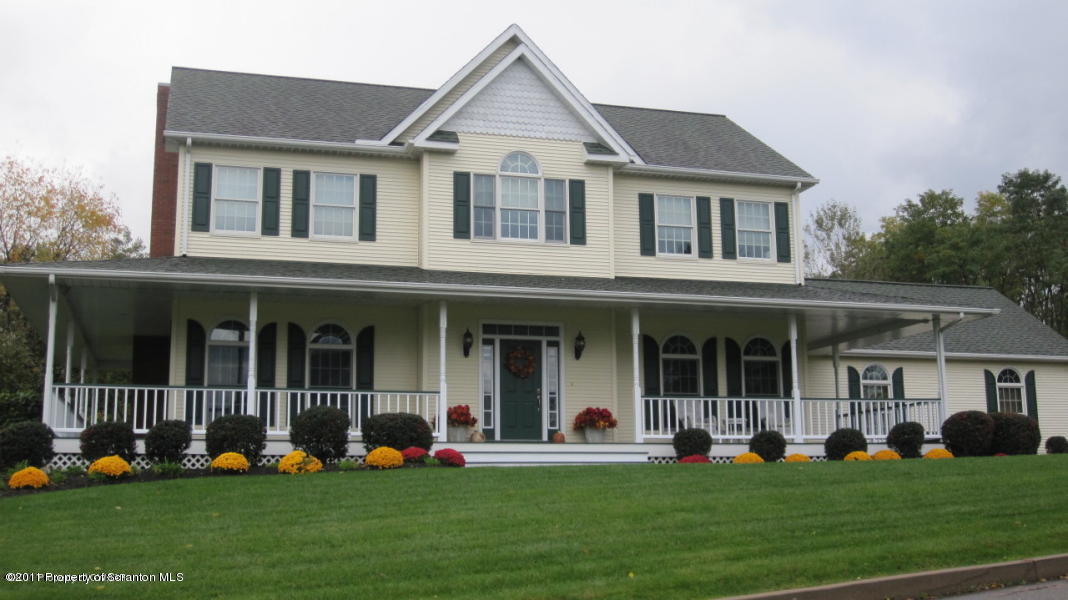 318 Willow Road Pittston, PA 18640 - Photo 1 of 8 a front view of a house with a yard