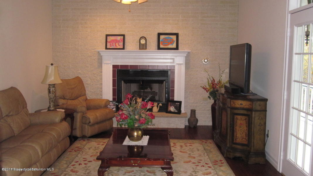 318 Willow Road Pittston, PA 18640 - Photo 4 of 8 a living room with furniture and a fireplace