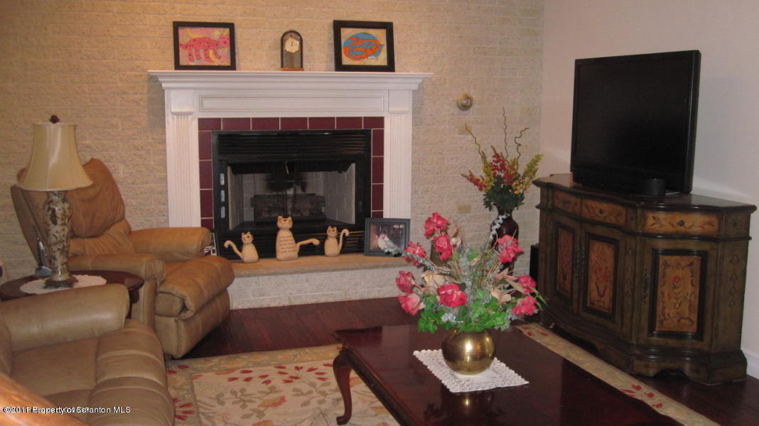 318 Willow Road Pittston, PA 18640 - Photo 5 of 8 a living room with furniture and a fireplace
