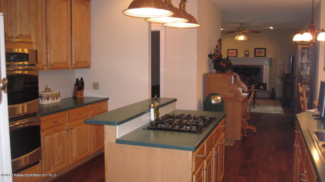 318 Willow Road Pittston, PA 18640 - Photo 6 of 8 a kitchen with stainless steel appliances granite countertop a stove and a refrigerator