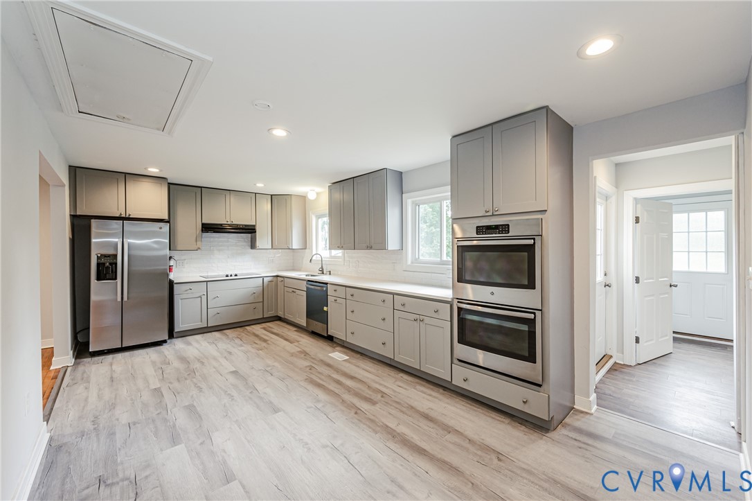 2015 Fordson Road Richmond, VA 23229 - Photo 9 of 48 Modern kitchen featuring grey shaker-style cabinet