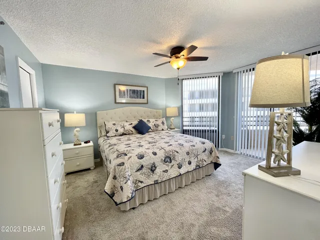 a spacious bathroom with a double vanity sink mirror and toilet