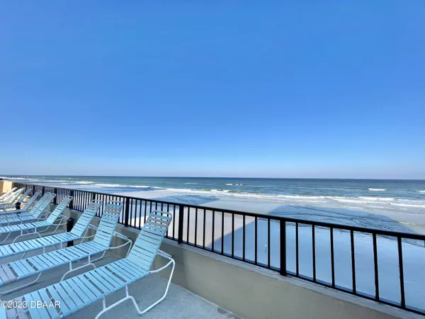 a balcony with wooden floor