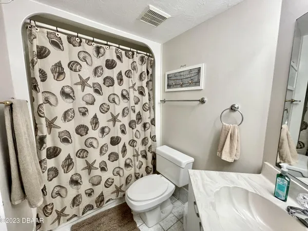a view of storage and utility room with washer and dryer