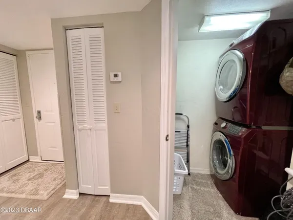 a view of a bedroom with furniture and window