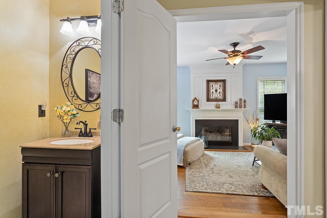 9529 Miranda Drive Raleigh, NC 27617 - Photo 16 of 39 The half bath is tucked in the long hallway behind the kitchen wall, offering privacy but conveniently located to all main floor living spaces