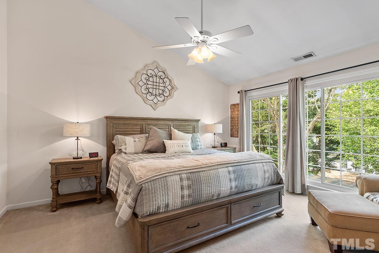 9529 Miranda Drive Raleigh, NC 27617 - Photo 17 of 39 Cathedral ceilings and floor to ceiling windows featured in the primary suite