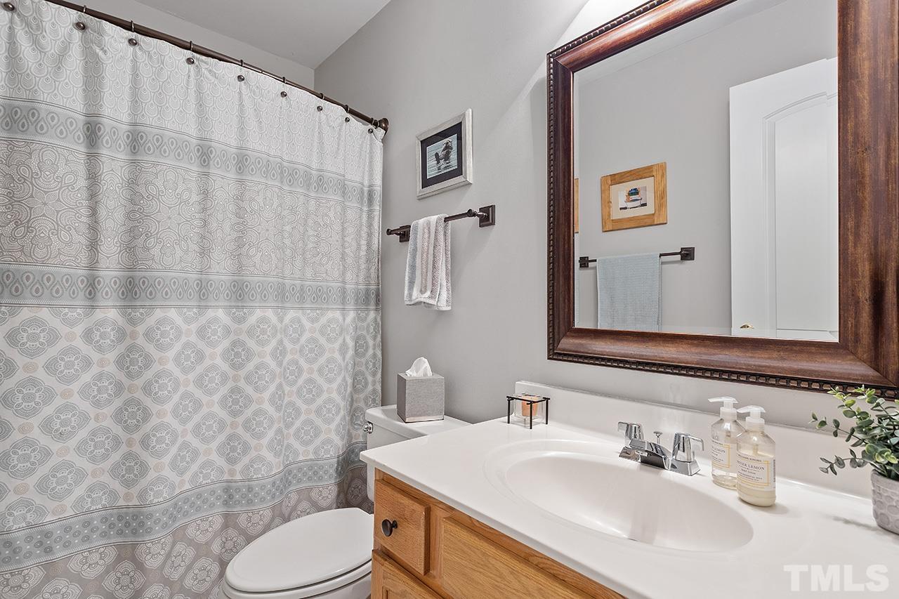9529 Miranda Drive Raleigh, NC 27617 - Photo 22 of 39 Second floor bathroom is conveniently located at the top of the hall between the secondary bedrooms