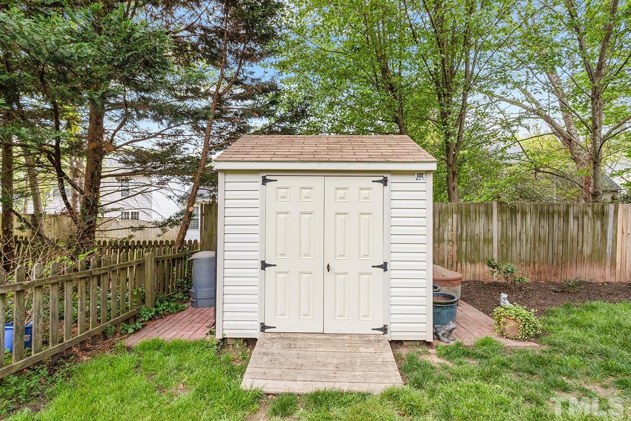 9529 Miranda Drive Raleigh, NC 27617 - Photo 29 of 39 The 8x8 shed complements the home's exterior paint and offers additional storage