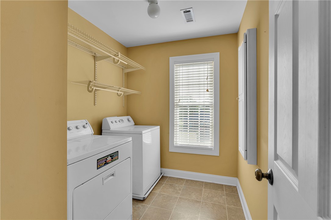 406 Hopewell Ridge Anderson, SC 29621 - Photo 31 of 46 This dedicated laundry room provides convenience and ample storage for household tasks.