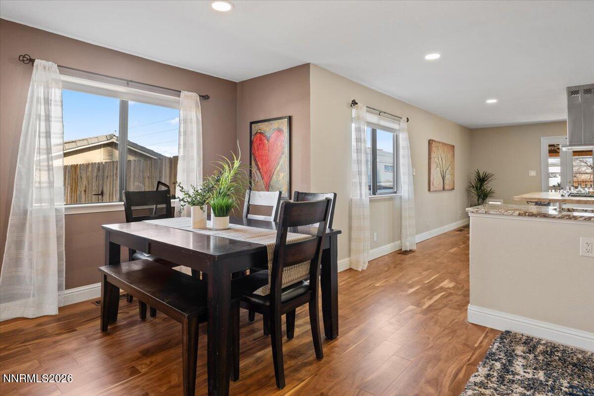 2224 Escalera Way Reno, NV 89523 - Photo 12 of 44 a view of a dining room with furniture window and wooden floor