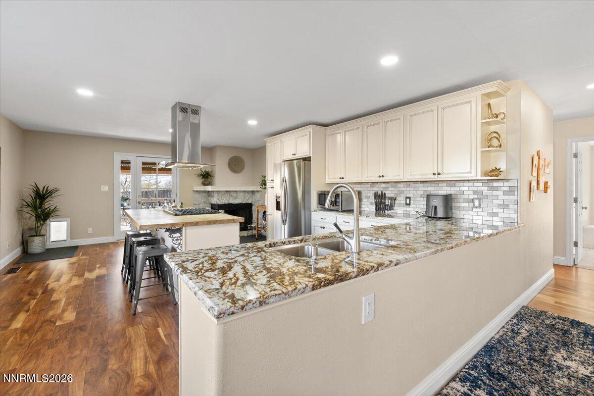 2224 Escalera Way Reno, NV 89523 - Photo 15 of 44 a kitchen with stainless steel appliances granite countertop a sink and a refrigerator