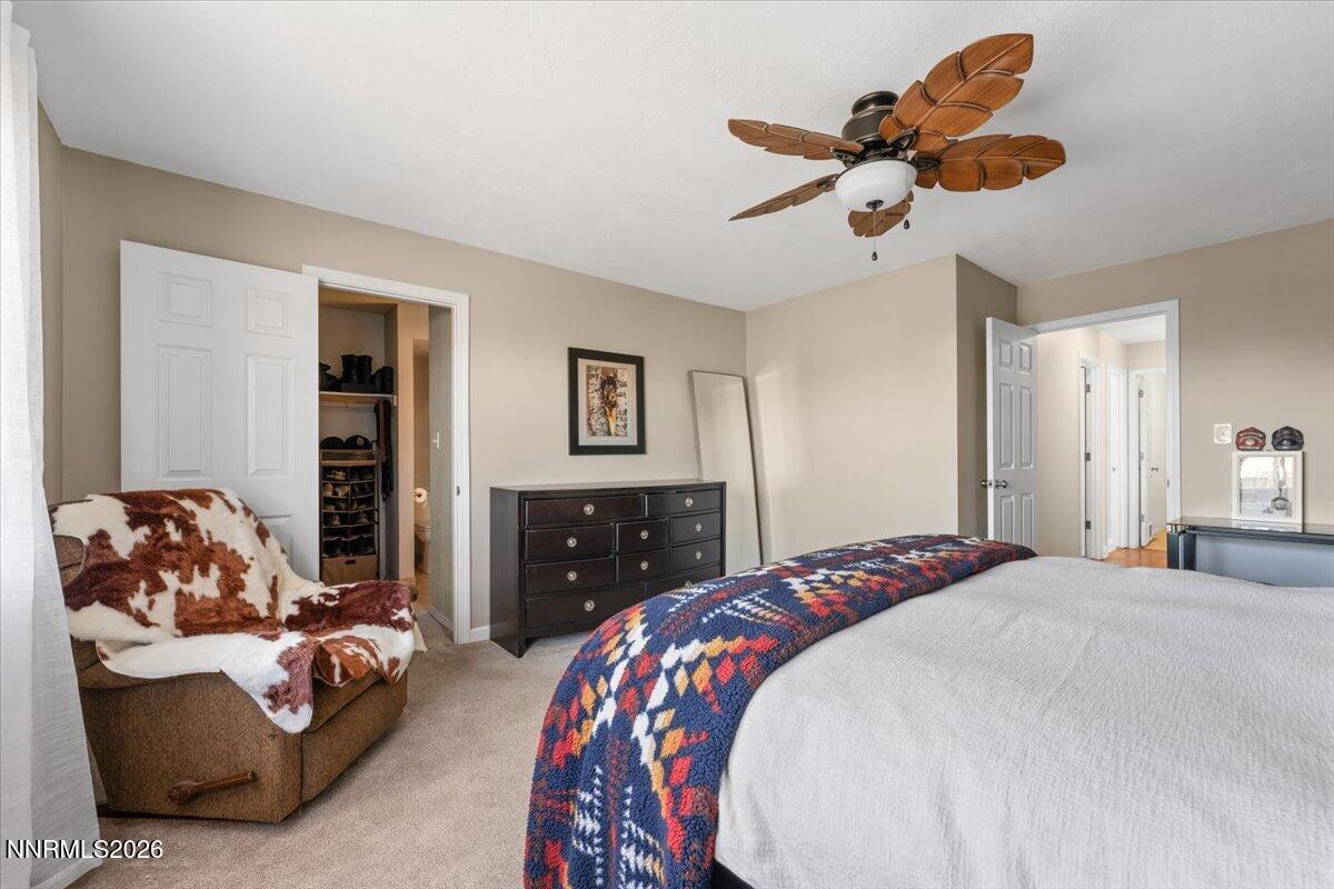 2224 Escalera Way Reno, NV 89523 - Photo 24 of 44 a bedroom with a large bed and a couch