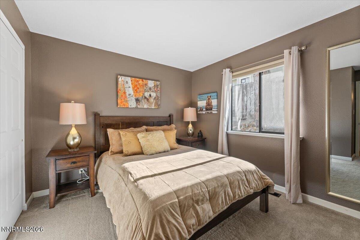 2224 Escalera Way Reno, NV 89523 - Photo 30 of 44 a bedroom with a bed and a night stand
