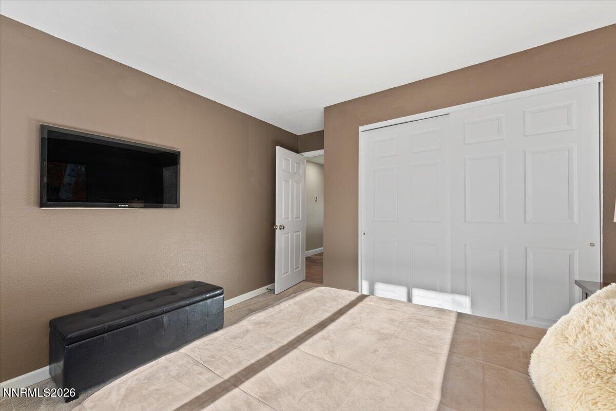 2224 Escalera Way Reno, NV 89523 - Photo 32 of 44 a bedroom with a bed and a flat screen tv