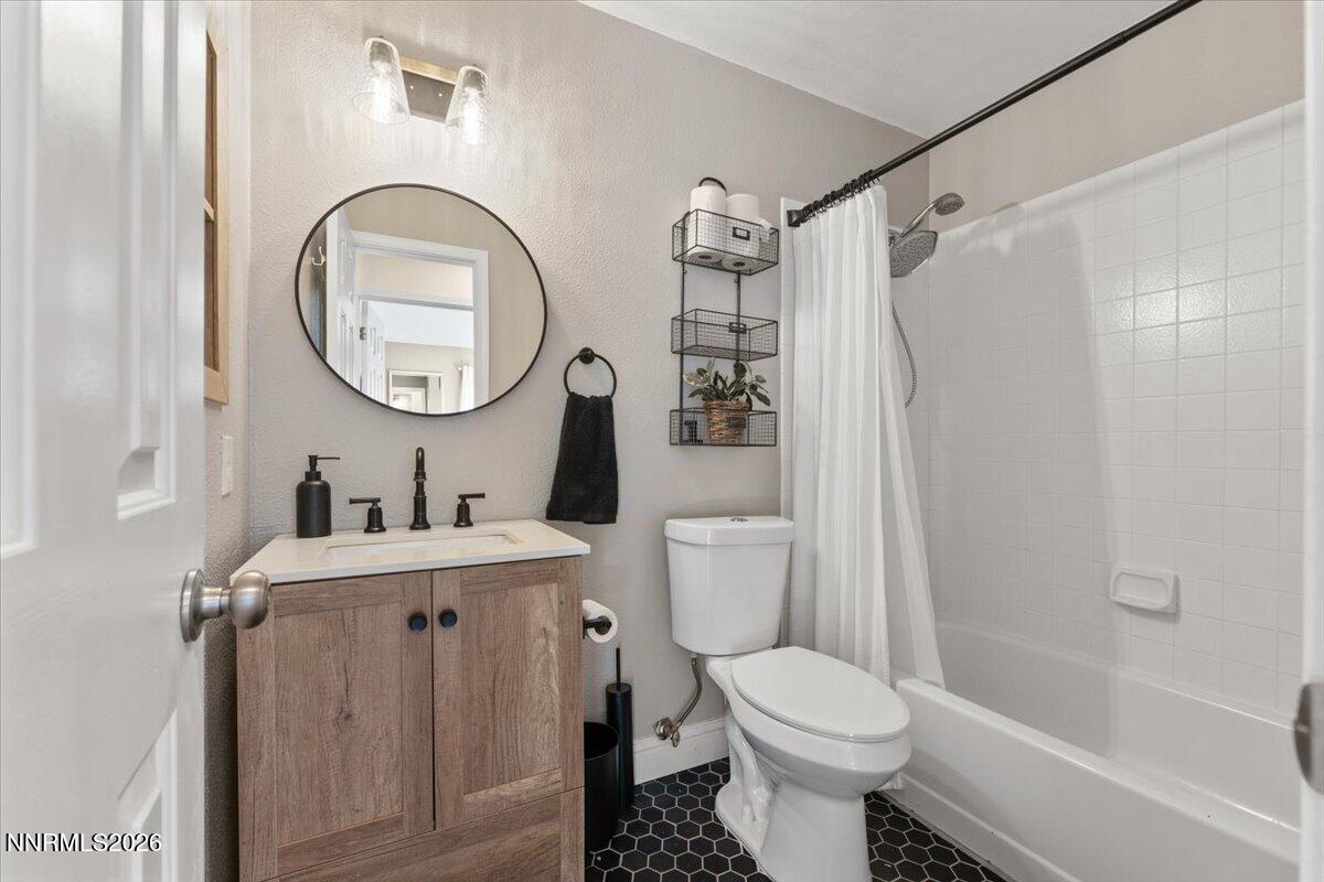 2224 Escalera Way Reno, NV 89523 - Photo 33 of 44 a bathroom with a toilet sink vanity tub and mirror