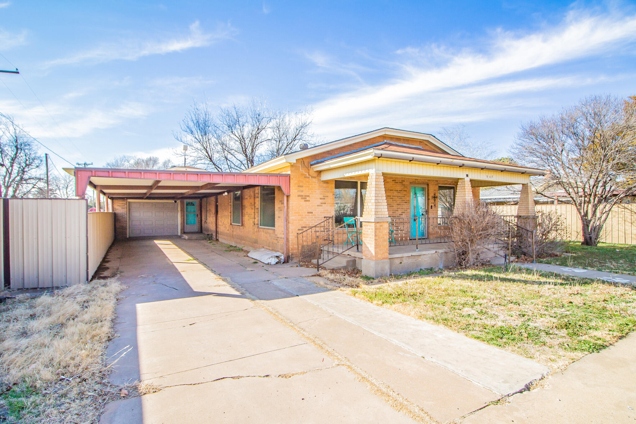 907 Ave H Hale Center, TX 79041 - Photo 1 of 32 a front view of a house with a yard