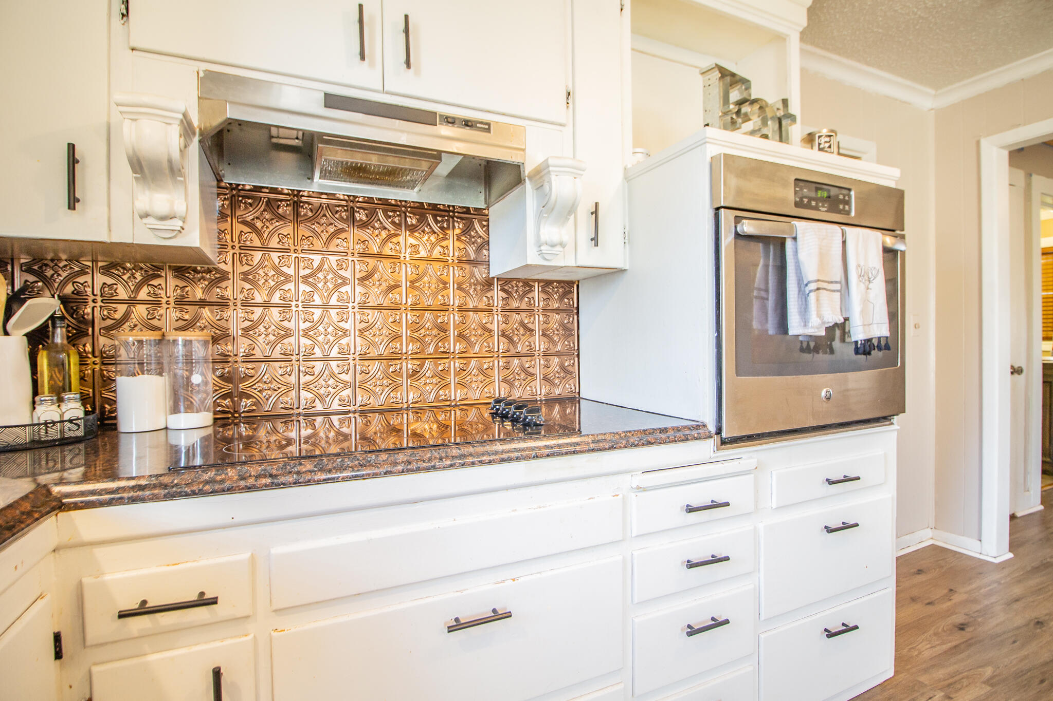 907 Ave H Hale Center, TX 79041 - Photo 14 of 32 a bathroom with a sink and a mirror