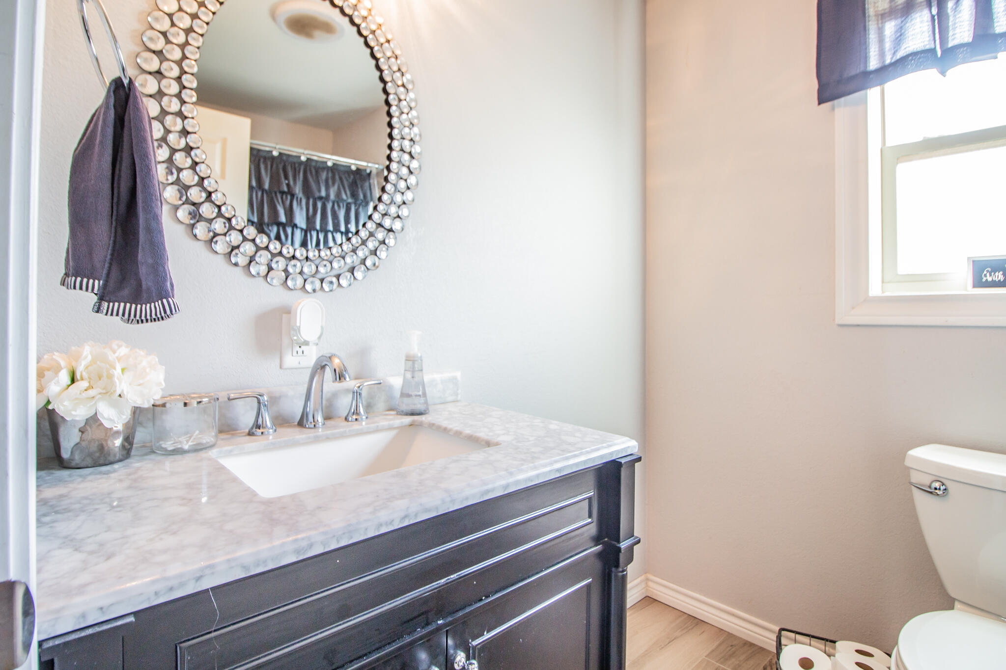 907 Ave H Hale Center, TX 79041 - Photo 18 of 32 a bathroom with a granite countertop sink and a mirror