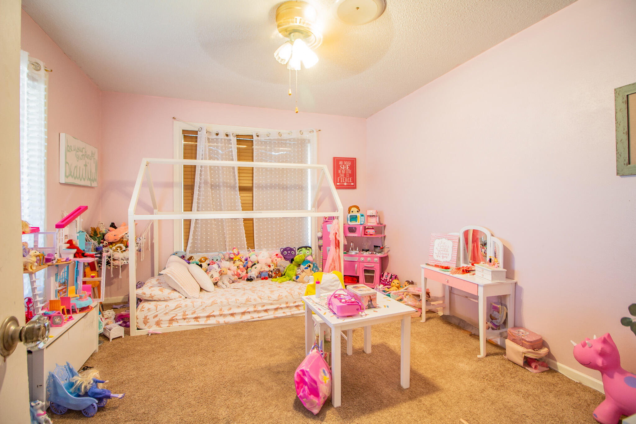 907 Ave H Hale Center, TX 79041 - Photo 22 of 32 a living room with furniture and toys
