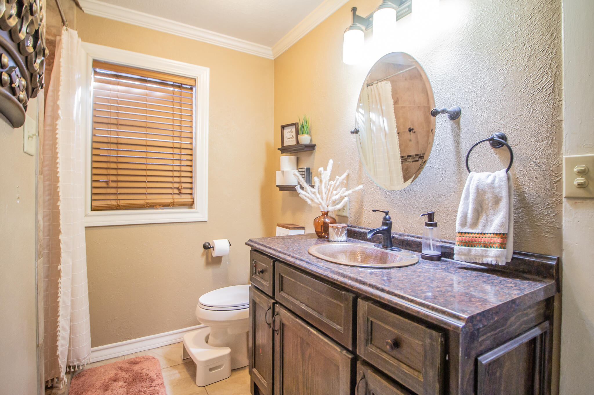 907 Ave H Hale Center, TX 79041 - Photo 24 of 32 a bathroom with a sink a toilet and a mirror