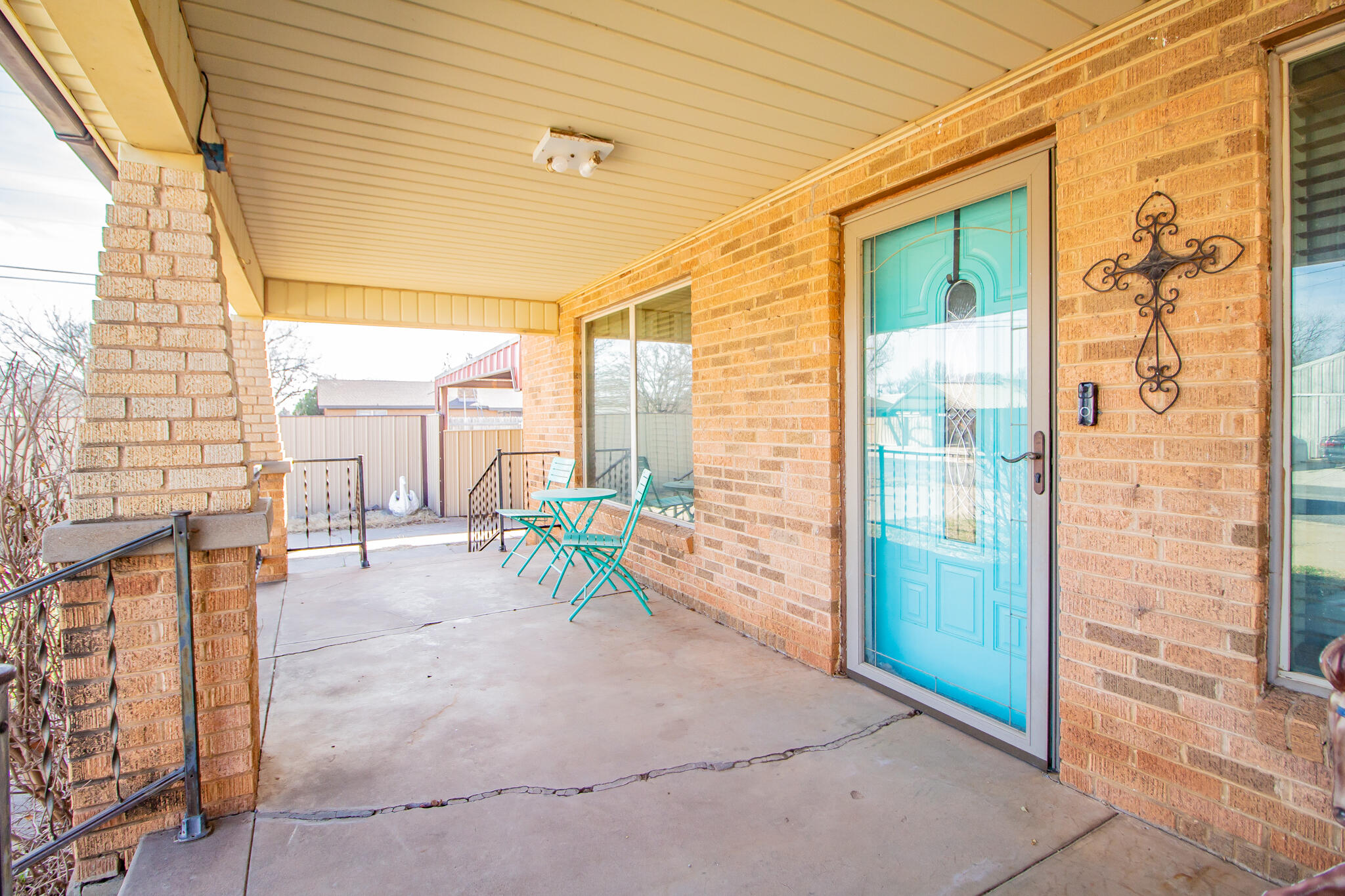 907 Ave H Hale Center, TX 79041 - Photo 3 of 32 a view of a porch with chairs and tables