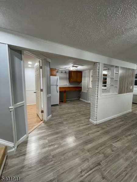 5 Wagon Wheel Road Vernon, NJ 07422 - Photo 2 of 8 a view of empty room with wooden floor