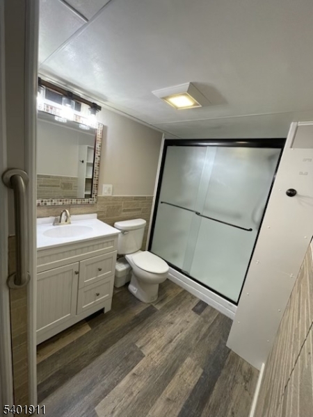 5 Wagon Wheel Road Vernon, NJ 07422 - Photo 3 of 8 a bathroom with a double vanity sink mirror and toilet