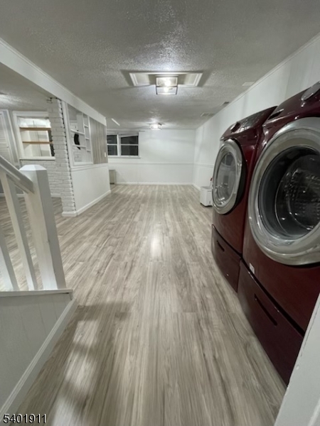 5 Wagon Wheel Road Vernon, NJ 07422 - Photo 4 of 8 a view of a hallway with washer and dryer