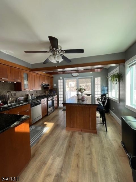 5 Wagon Wheel Road Vernon, NJ 07422 - Photo 5 of 8 a living room with stainless steel appliances kitchen island granite countertop furniture and a large window