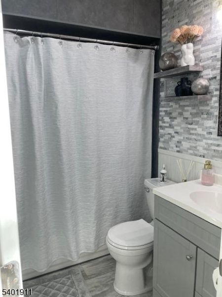 5 Wagon Wheel Road Vernon, NJ 07422 - Photo 7 of 8 a bathroom with a sink and a toilet