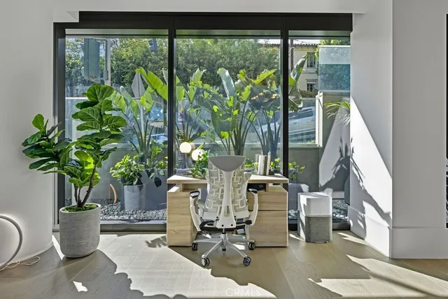 a view of a chairs and table in the balcony