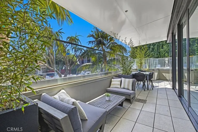 a spacious bedroom with a bed and ceiling fan